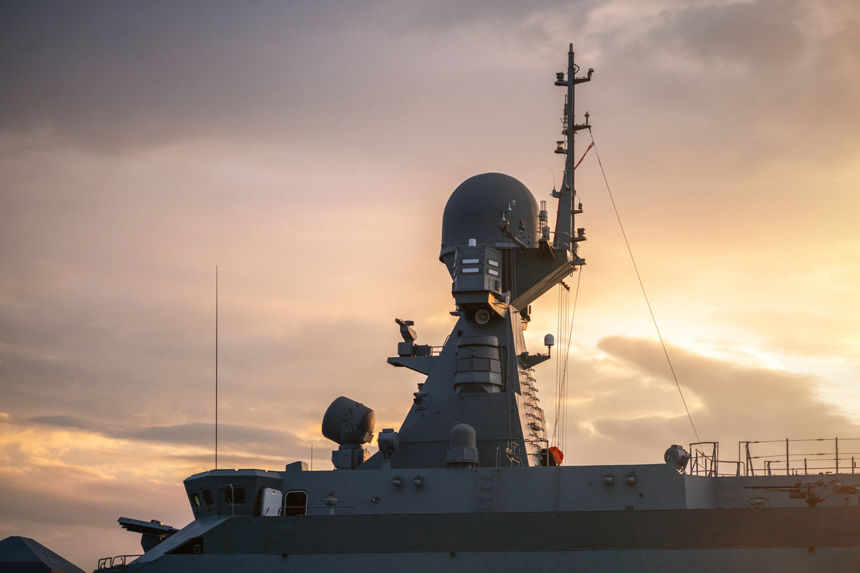 Navigation radar tower on warship at sunset close up